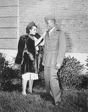 “The first Negro to be commissioned in the Marine Corps has his second lieutenant’s bars pinned on by his wife. He is Frederick C. Branch of Charlotte, NC.”, 