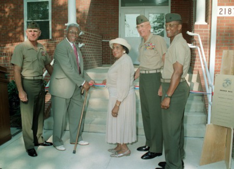 Mr. Frederick Clinton Branch cuts the ribbon and officially dedicates Branch Hall at the Officer Candidates School. Assisting Mr. Branch are his wife; Brig. Gen. E. C. Kelly (left), Lt. Gen. P. K. Van Riper and Col. A. David. Photo taken July 9, 1997.