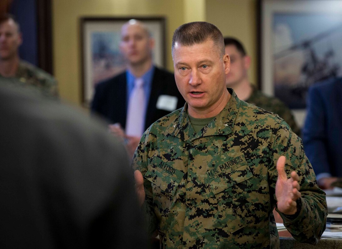 Brig. Gen. J.D. Alford, commanding general, Marine Corps Warfighting Laboratory/Futures Directorate, talks with Science Fiction Writer's Workshop participants Feb. 4.