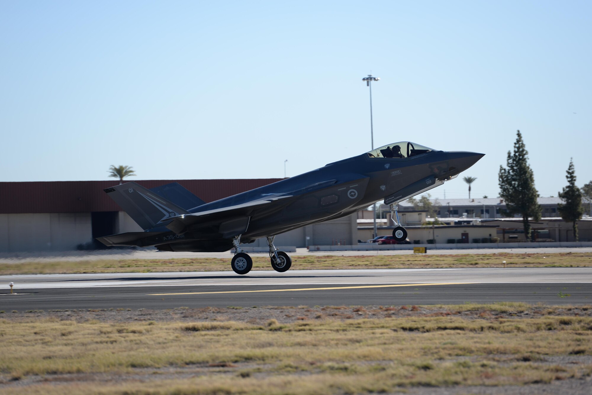 An Australian F-35 Lightning II lands at Luke Air Force Base Feb. 2, 2016. Luke conducts a joint international F-35 training mission with partner nations Norway, Italy, and Australia. The F-35 is a fifth-generation all-weather multi-role strike fighter. 