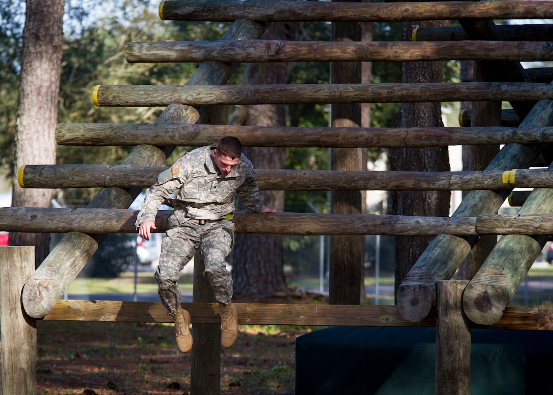Spc. Alex Taussig a U.S. Army Reserve Military Police from Manhattan, Kan., assigned to the 530th Military Police Battalion, completes the over-and-under event during an obstacle course at this year's 200th Military Police Command's Best Warrior Competition held at Camp Blanding, Fla., Feb. 9. The winning noncommissioned officer and junior enlisted Soldiers will move on the U.S. Army Reserve Command competition in May. (U.S. Army Photo by Sgt. Audrey Ann Hayes)