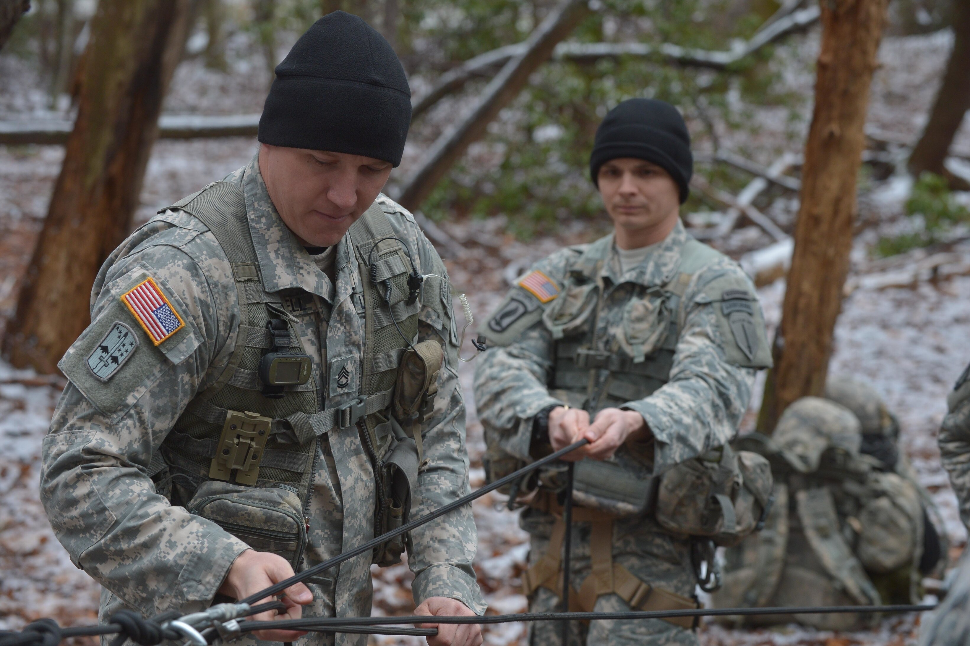 US Army military mountaineering instructor demonstrates basic skills to