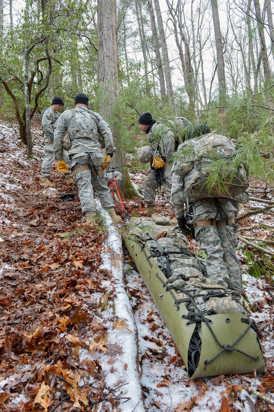 U.S. Army soldiers assigned to 5th Ranger Training Battalion hoist a simulated patient on a litter during the Basic Military Mountaineering Course at Camp Frank D. Merrill, Dahlonega, Ga., Jan. 21, 2016. The Basic Military Mountaineering Course trains Soldiers in the fundamental knowledge/skills required to successfully conduct small unit operations in mountainous terrain found throughout the world. (U.S. Army photo by Staff Sgt. Alex Manne/Released)