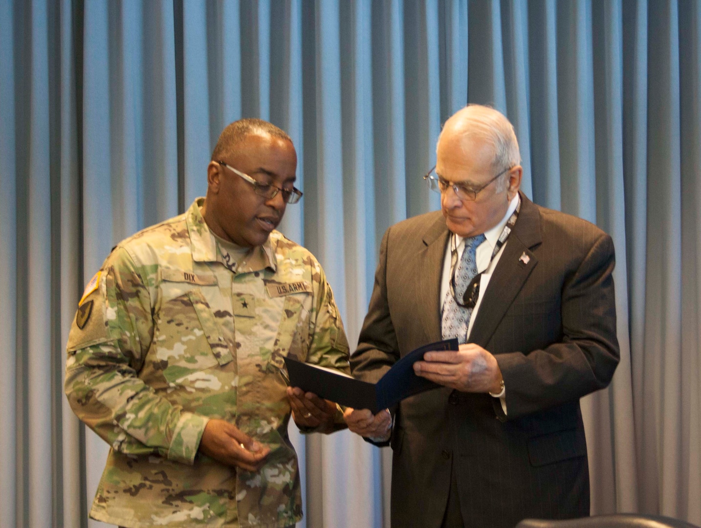 Army Brig. Gen. Richard Dix honors Joseph Spielbauer during a ceremony at DLA Distribution Jan. 28.