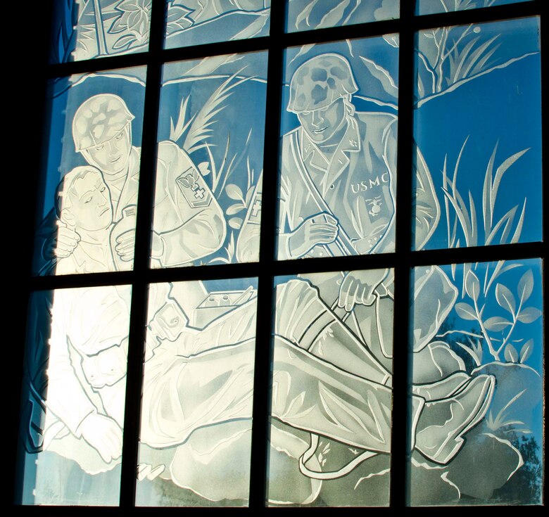 The Marine Corps is supported by the Naval Medical Corps. This scene salutes the doctors and corpsmen of the Naval Medical Corps.
