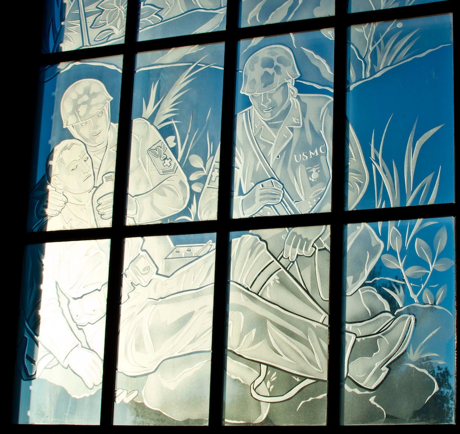 The Marine Corps is supported by the Naval Medical Corps. This scene salutes the doctors and corpsmen of the Naval Medical Corps.
