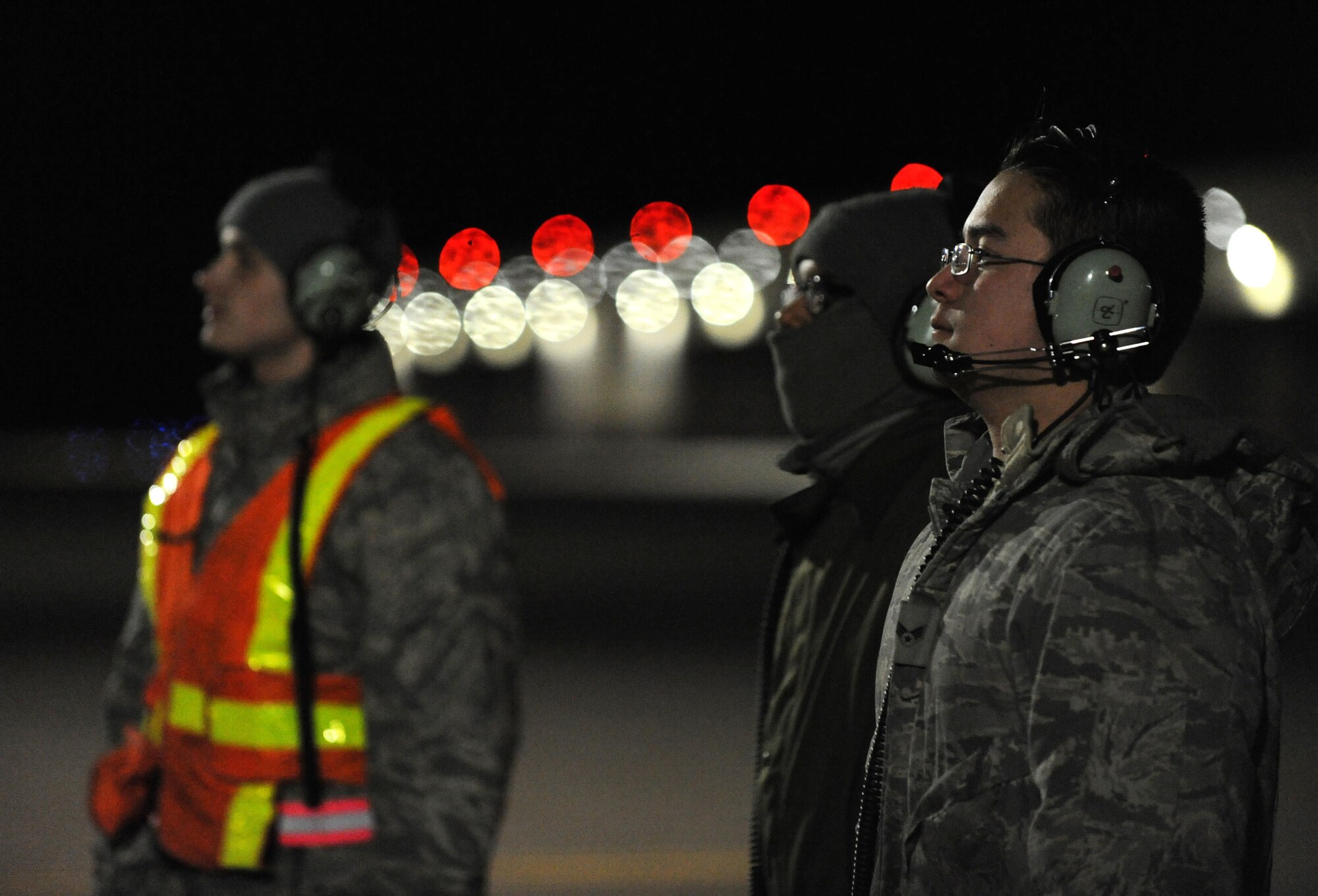 U.S. Air Force Airman 1st Class Andrew Dutton, (left to right), Senior Airman Detroy Brooks and Senior Airman Michael Saulsberry, 509th Aircraft Maintenance Squadron crew chiefs, communicate pre-flight instructions with a B-2 Spirit pilot at Whiteman Air Force Base, Mo., Feb. 2, 2016, during Red Flag (RF) 16-1. The work completed by crew chiefs provides mission-capable aircraft for B-2 pilots so they can provide strike capability, serving a vital role in the overall RF mission. (U.S. Air Force photo by Tech. Sgt. Miguel Lara III)