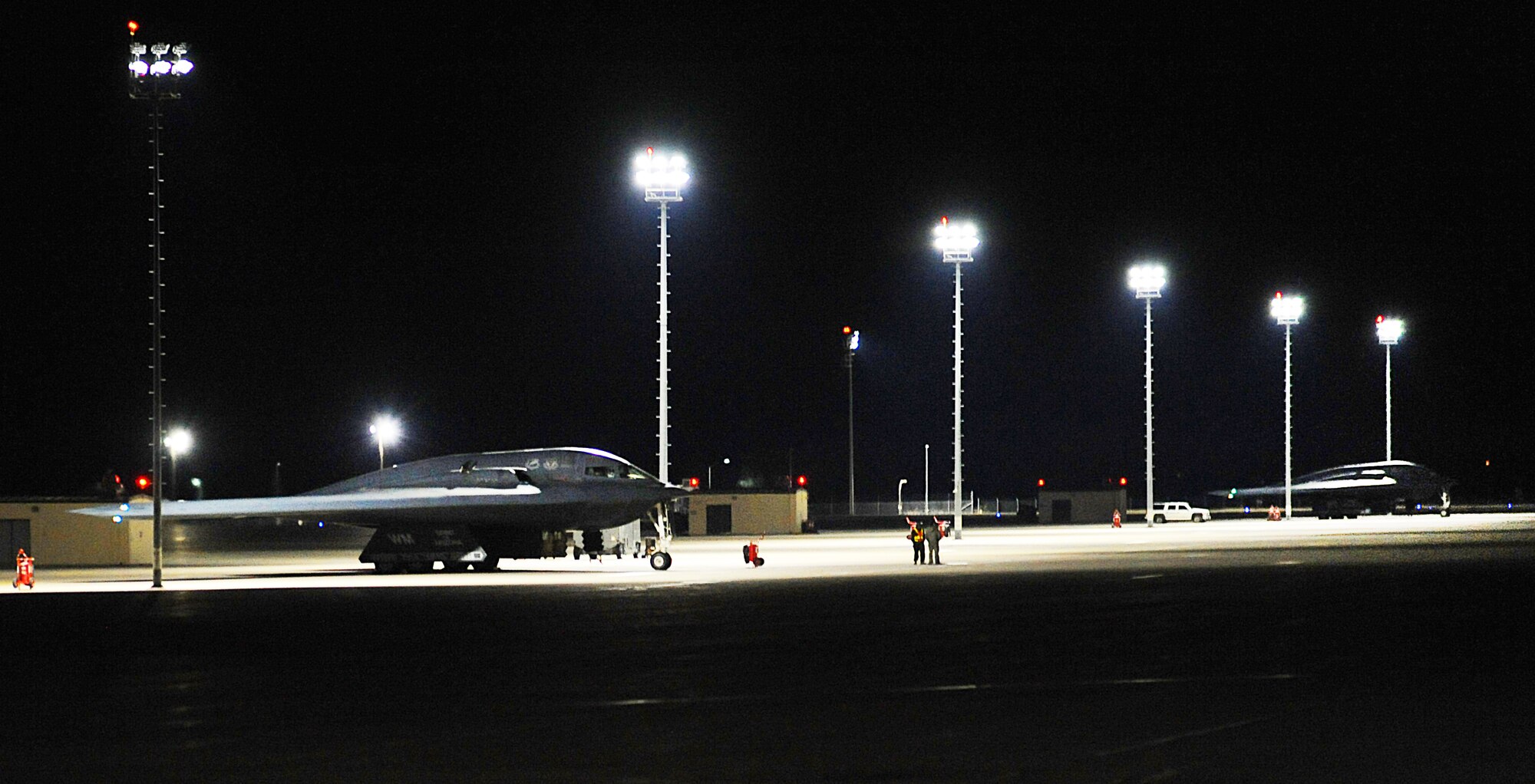 Airmen assigned to the 509th Aircraft Maintenance Squadron conclude final inspections on two B-2 Spirit aircraft prior to takeoff at Whiteman Air Force Base, Mo., Feb. 2, 2016. The B-2, along with more than 130 aircraft from international air forces, are taking part in the three-week long Red Flag (RF) 16-1 coordinated by Nellis AFB, Nev. 