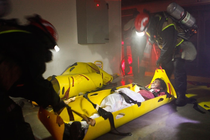 Marines and Sailors with Chemical Biological Incident Response Force (CBIRF), U.S. Marine Corps Forces Command (MARFORCOM), take part in exercise Scarlet Response 2015 at the Guardian Centers in Perry, Ga., July 21 – 24, 2015. The exercise tested all the specific skills the unit possesses to respond to an incident of chemical, biological, radiological, nuclear or high-yield explosive (CBRNE) event. (U.S. Marine Corps photo by Sgt. Jonathan Herrera/Released) 