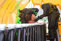 Marines and Sailors with Chemical Biological Incident Response Force (CBIRF), U.S. Marine Corps Forces Command (MARFORCOM), take part in exercise Scarlet Response 2015 at the Guardian Centers in Perry, Ga., July 21 – 24, 2015. The exercise tested all the specific skills the unit possesses to respond to an incident of chemical, biological, radiological, nuclear or high-yield explosive (CBRNE) event. (U.S. Marine Corps photo by Sgt. Jonathan Herrera/Released)