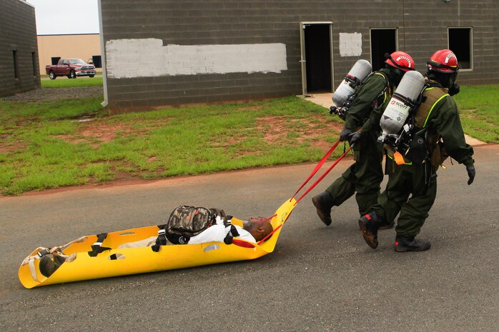 Marines and Sailors with Chemical Biological Incident Response Force (CBIRF), U.S. Marine Corps Forces Command (MARFORCOM), take part in exercise Scarlet Response 2015 at the Guardian Centers in Perry, Ga., July 21 – 24, 2015. The exercise tested all the specific skills the unit possesses to respond to an incident of chemical, biological, radiological, nuclear or high-yield explosive (CBRNE) event. (U.S. Marine Corps photo by Sgt. Jonathan Herrera/Released)