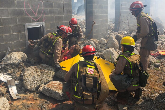 Marines and Sailors with Chemical Biological Incident Response Force (CBIRF), U.S. Marine Corps Forces Command (MARFORCOM), take part in exercise Scarlet Response 2015 at the Guardian Centers in Perry, Ga., July 21 – 24, 2015. The exercise tested all the specific skills the unit possesses to respond to an incident of chemical, biological, radiological, nuclear or high-yield explosive (CBRNE) event. (U.S. Marine Corps photo by Sgt. Jonathan Herrera/Released) 