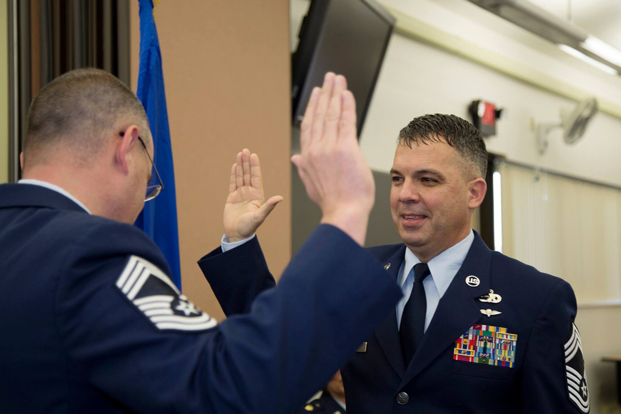 Senior Master Sergeant James Child is promoted to Chief Master Sergeant in a ceremony presided by Maj. Jolane McCarthy, Commander, 45th Aerial Port Squadron on Feb. 7, 2016 at Travis Air Force Base, Calif. Childs is the 45th APS air transportation manager and senior Air Reserve Technician. Childs has been in the Air Force Reserve for 28 years. (U.S. Air Force photo/Maj. Samuel Lee)