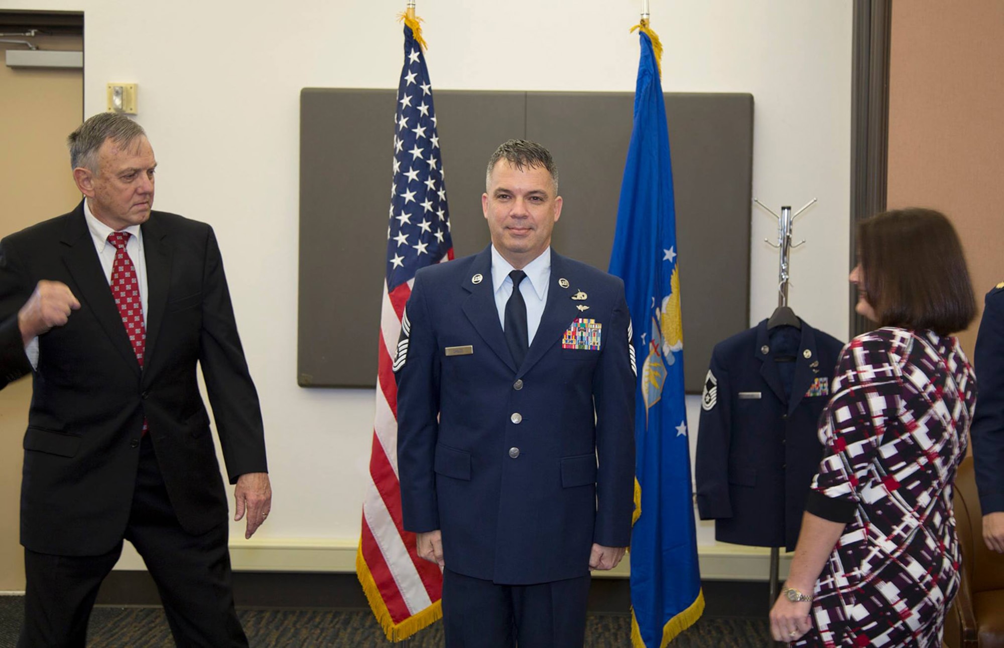 Senior Master Sergeant James Child is promoted to Chief Master Sergeant in a ceremony presided by Maj. Jolane McCarthy, Commander, 45th Aerial Port Squadron on Feb. 7, 2016 at Travis Air Force Base, Calif. Childs is the 45th APS air transportation manager and senior Air Reserve Technician. Childs has been in the Air Force Reserve for 28 years. (U.S. Air Force photo/Maj. Samuel Lee)
