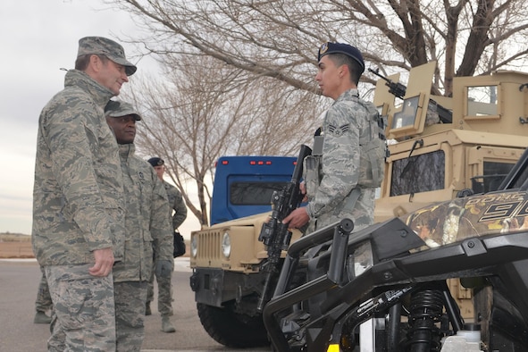 Gen. Robin Rand, Air Force Global Strike Command commander, and Chief Master Sgt. Calvin Williams, AFGSC command chief, learn from security specialist Senior Airman Isaac Gonzalez about the 377th Weapons System Security Squadron. Rand was at Kirtland Air Force Base Feb. 4-5 to meet with Airmen and learn more about the base's missions.