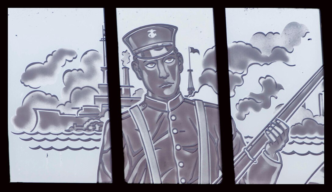 The central figure portrays a Marine, in a uniform during the time period of the war with Spain. The background depicts the Morro Castle as it appears on the Spanish American War Campaign Medal.