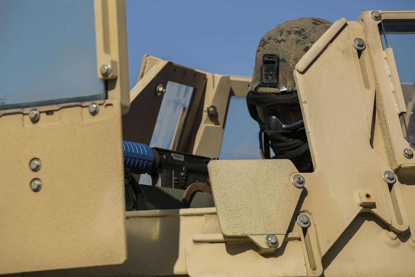 Marines with 2nd Law Enforcement Battalion stay vigilant as they drive through a village with possible hostiles and improvised explosive devices at Camp Lejeune, N.C., Feb. 9, 2016. During the time the Marines spent in the field, they encountered multiple obstacles and confronted different scenarios in preparation for an upcoming deployment with the 24th Marine Expeditionary Unit. The obstacles that they faced included rugged environments, improvised explosive devices and ambushes by the enemy. (U.S. Marine Corps photo by Lance Cpl. Luke Hoogendam/Released)
