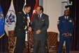 Chief Master Sgt. Boston A. Alexander, senior enlisted advisor Defense Equal Opportunity Management Institute, observes as Dr. Jose Bolton, dean of Equal Opportunity and Equal Employment Opportunity, DEOMI, congratulates Maj. Gen. A.C. Roper, commander 80th Training Command, after Roper delivered the keynote address during the Equal Opportunity Advisors Reserve Component Course graduation ceremony at DEOMI, Patrick Air Force Base, Fla., Feb. 5, 2016.