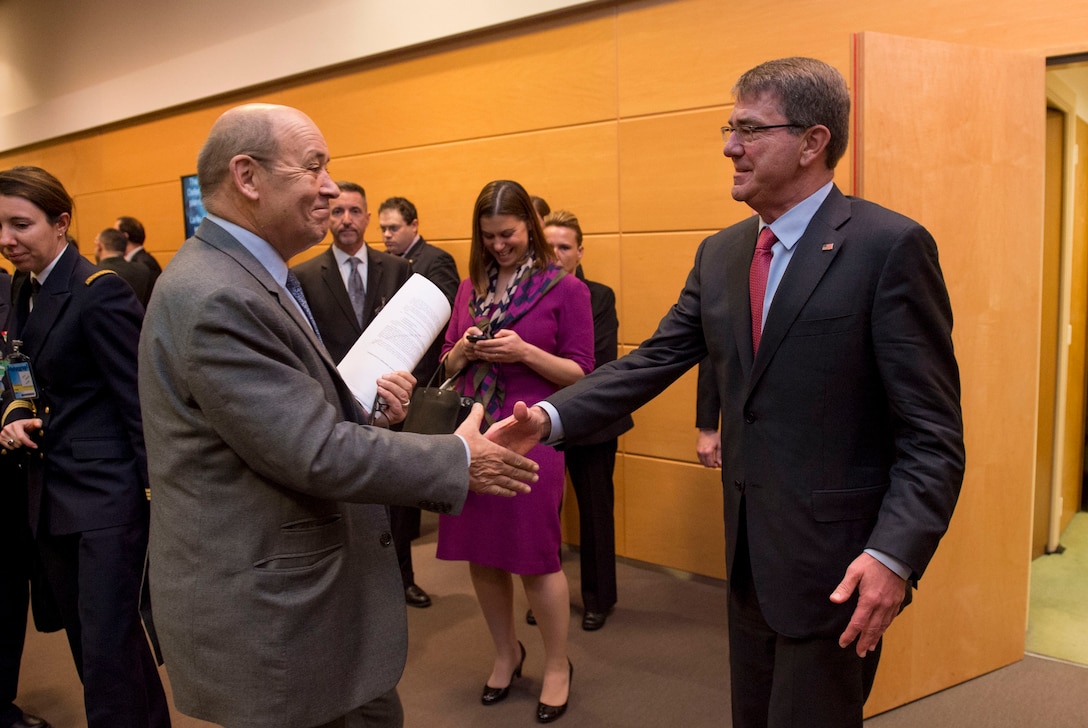 Defense Secretary Ash Carter, right, greets the French Defense Minister Jean-Yves Le Drian as they meet at NATO headquarters in Brussels, Feb. 11, 2016, to discuss matters of mutual importance. DoD photo by Air Force Senior Master Sgt. Adrian Cadiz