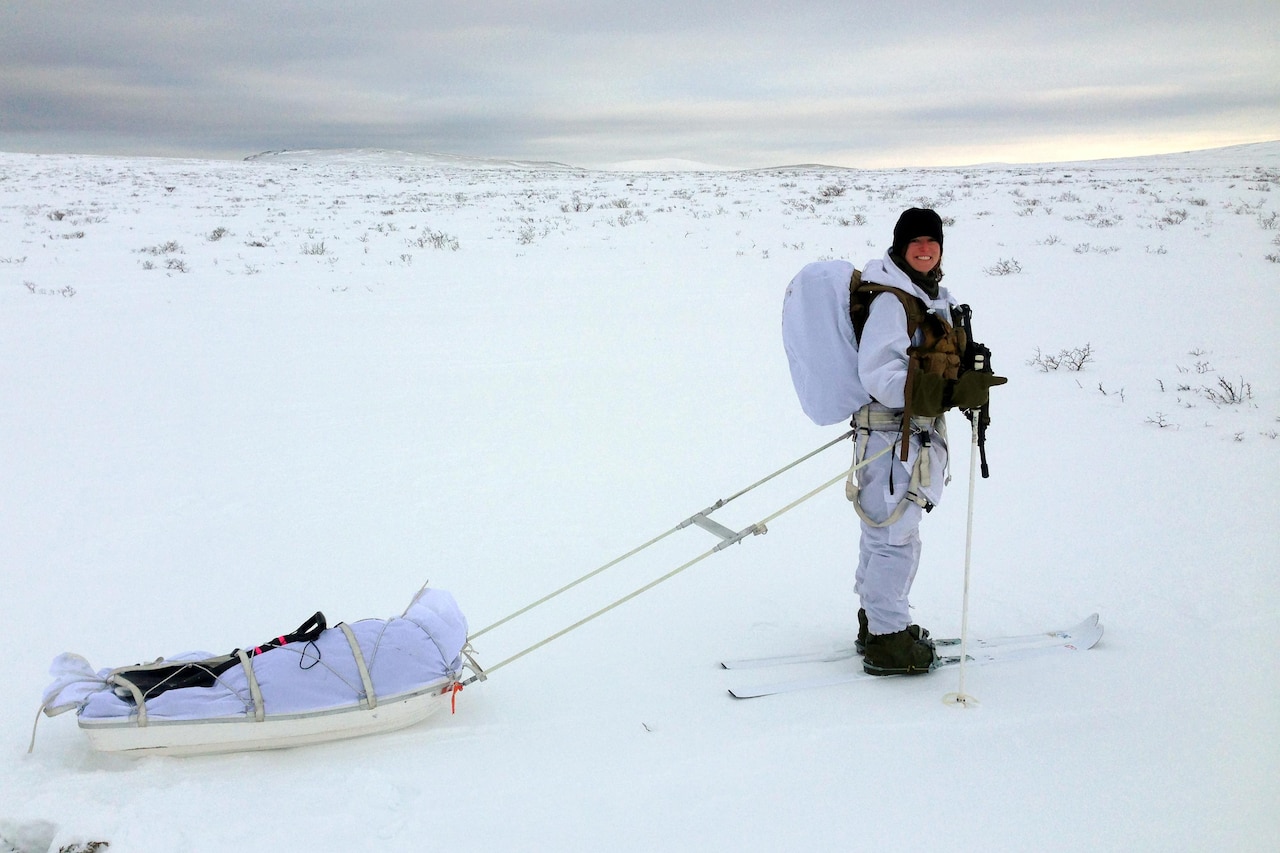 U.S. Army Capt. Kate Alfin, a UH-60 Black Hawk helicopter pilot with the 12th Combat Aviation Brigade based at Ansbach, Germany, practices Nordic cross-country skiing under a full combat load at the Allied Winter Course at the Norwegian School of Winter Warfare in Elverum, Norway, Jan. 15, 2016. The Allied Winter Course provides students with basic knowledge and practical experience to operate in cold weather environments to include survival, mobility and leadership under winter conditions. Norwegian Army photo
