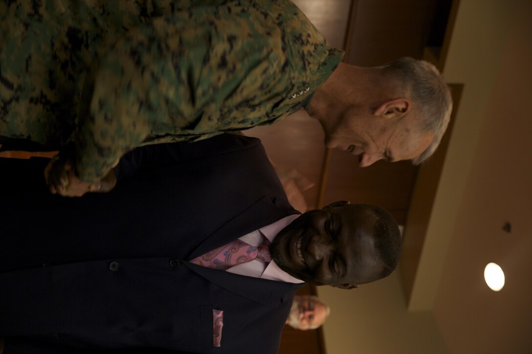 Anthony T. Davis, deputy branch head of Training and Readiness Division, Marine Forces Reserve, is congratulated by Lt. Gen. Rex C. McMillian, commander of Marine Forces Reserve, during the Civilian of the Year ceremony, Feb. 5, 2016, at Marine Corps Support Facility New Orleans. Davis was the recipient of the 2015 senior Civilian of the Year award for Marine Forces Reserve. (U.S. Marine Corps photo by Lance Cpl. Melissa Martens/ Released)