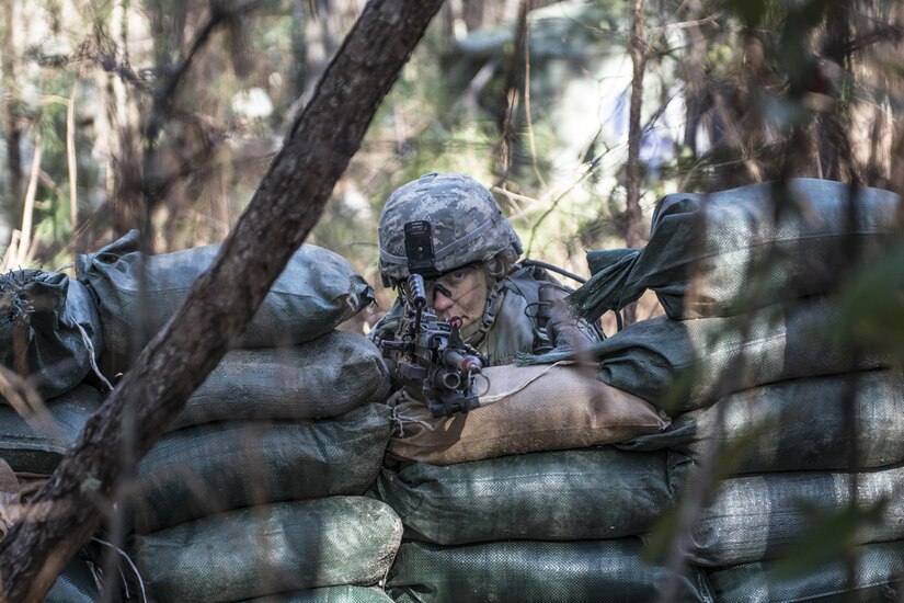 Army Reserve Soldier Pvt. Melissa Stamey, C Company, 1st Battalion, 61st Infantry Regiment, mans the M249 light machine gun after rebuilding her firing position when the wall of sandbags collapsed around her during the Victory Forge field training exercise at Fort Jackson, S.C., Feb. 10, 2016. Victory Forge is the culminating event just before graduation for Soldiers at Fort Jackson in Basic Combat Training. Stamey will head to Fort Lee, Va. after basic where she will attend Advanced Individual Training as a Supply Specialist. (U.S. Army photo by Sgt. 1st Class Brian Hamilton)