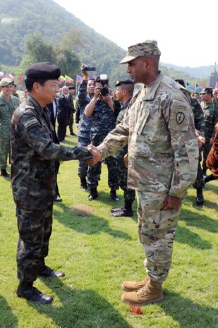 General Sommai Kaotira, the Chief of Defense Forces and Brigadier Gen. Gary M. Brito, Operations Deputy Commanding general for the 25th Infantry Division greet one another with a handshake during the Cobra Gold 16 opening ceremony Feb. 9, at the Royal Thai Marines Corps HQ, Sattahip Chonburi Province, Thailand. Cobra Gold is a Thai- U.S. co-sponsored exercise that represents the longstanding friendship between the Thai and American peoples.