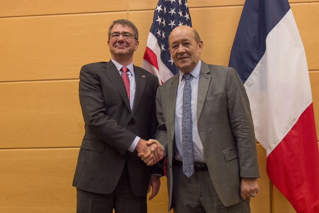 Defense Secretary Ash Carter, left, greets the French Defense Minister Jean-Yves Le Drian as they meet at NATO headquarters in Brussels, Feb. 11, 2016. DoD photo by U.S. Air Force Senior Master Sgt. Adrian Cadiz