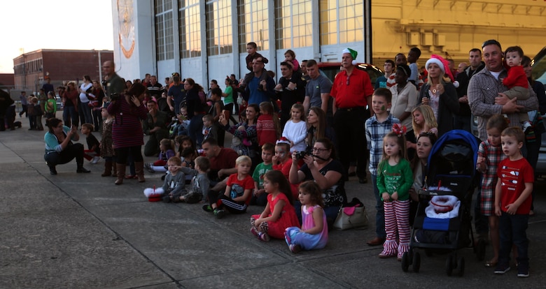 Marine, Sailors and their family members wait outside Marine Aerial Refueler Transport Squadron 252 hangar for Gunny Clause to arrive during the 7th annual Winter Wonderland at Marine Corps Air Station Cherry Point, N.C., Dec. 11, 2015. More than 700 Marines, Sailors and family members participate in the event. Winter Wonderland was hosted by Marine Aircraft Group 14 to foster camaraderie and increase esprit de corps within MAG-14 subordinate commands.