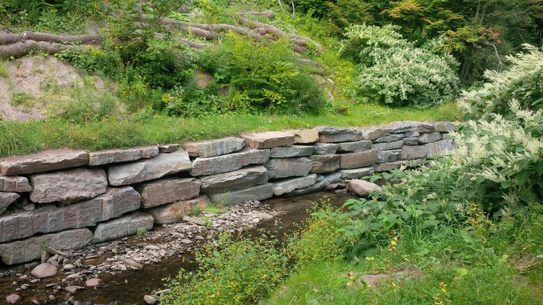 Third Brook’s stream banks are stabilized today with large rock at the toe of the banks and native plant vegetation. 