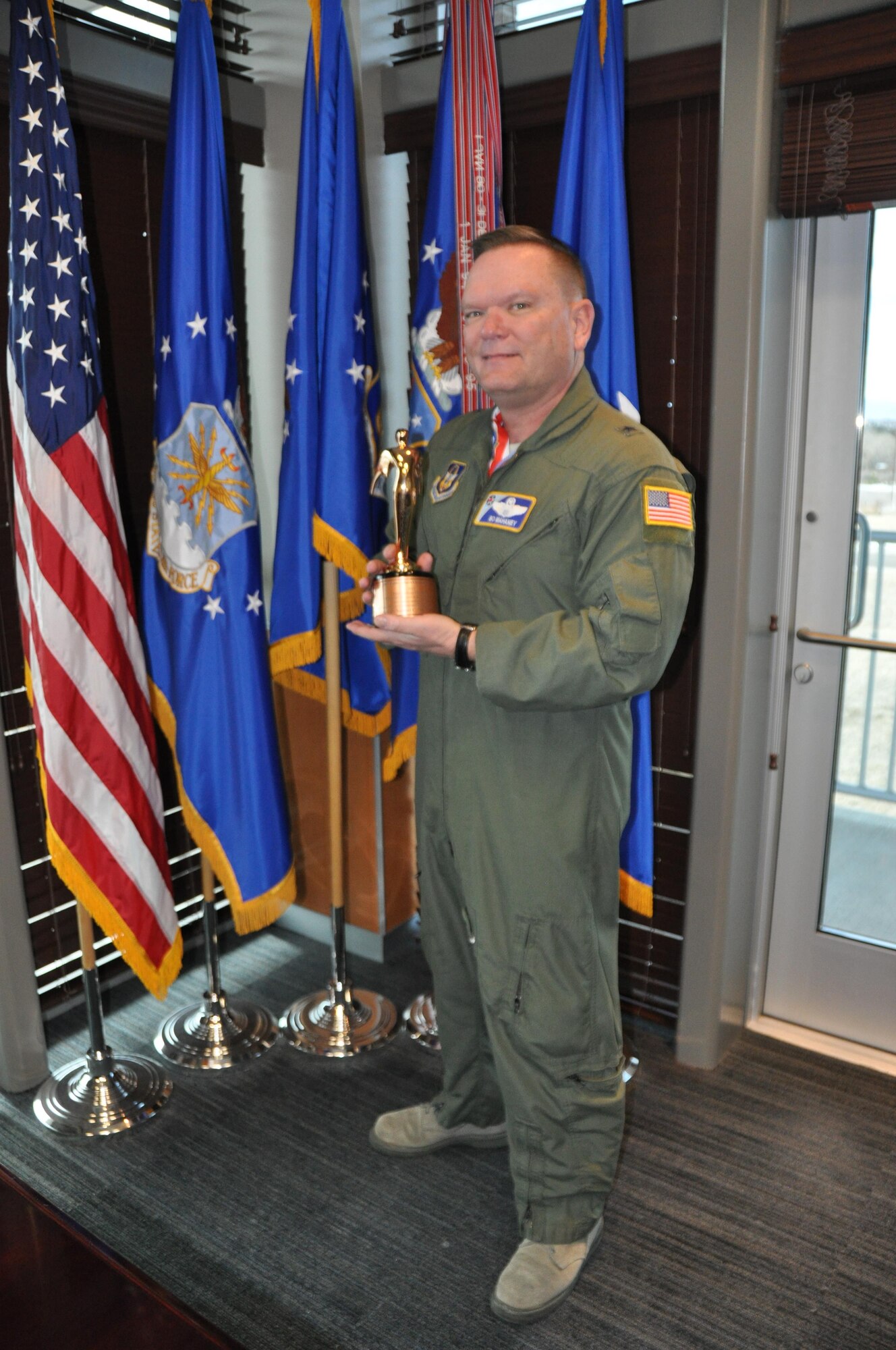 Brig. Gen. Samuel "Bo" Mahaney, Air Reserve Personnel Center commander, stands with his award Feb. 11 at ARPC on Buckley Air Force Base, Colo. Mahaney received the Public Affairs Champion award during the 2016 Air Force Reserve Command Leadership Symposium Feb. 9 at Marietta, Ga. The award recognizes commanders who are highly supportive and involved in the public affairs career field. (U.S. Air Force photo/Tech. Sgt. Rob Hazelett)