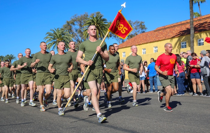 Marines of Bravo Company, 1st Recruit Training Battalion, run in formation during their motivation run at Marine Corps Recruit Depot San Diego, Feb. 11. After the Marines graduate recruit training, they receive 10 days of leave before reporting to the School of Infantry at Marine Corps Base Camp Pendleton, Calif., for Marine Combat Training. Annually, more than 17,000 males recruited from the Western Recruiting Region are trained at MCRD San Diego. Bravo Company is scheduled to graduate Feb. 12.