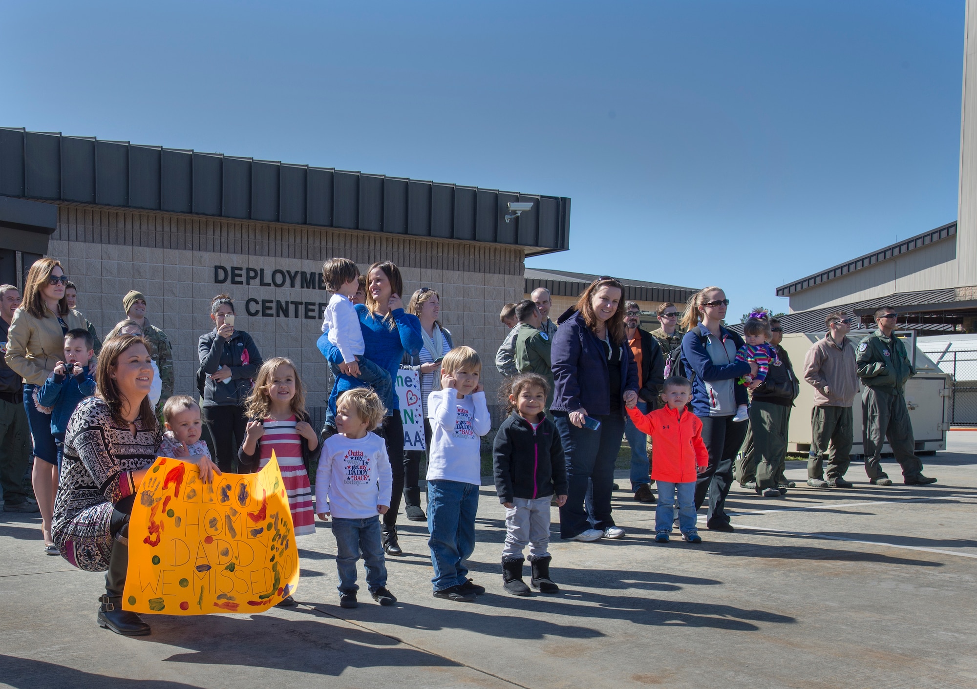 Families wait for their Airmen outside the deployment control center, Feb. 10, 2016, at Moody Air Force Base, Ga. The 41st Rescue Squadron maintains combat-ready status as an HH-60G personnel recovery squadron.(U.S. Air Force photo by Airman Daniel Snider/Released)
