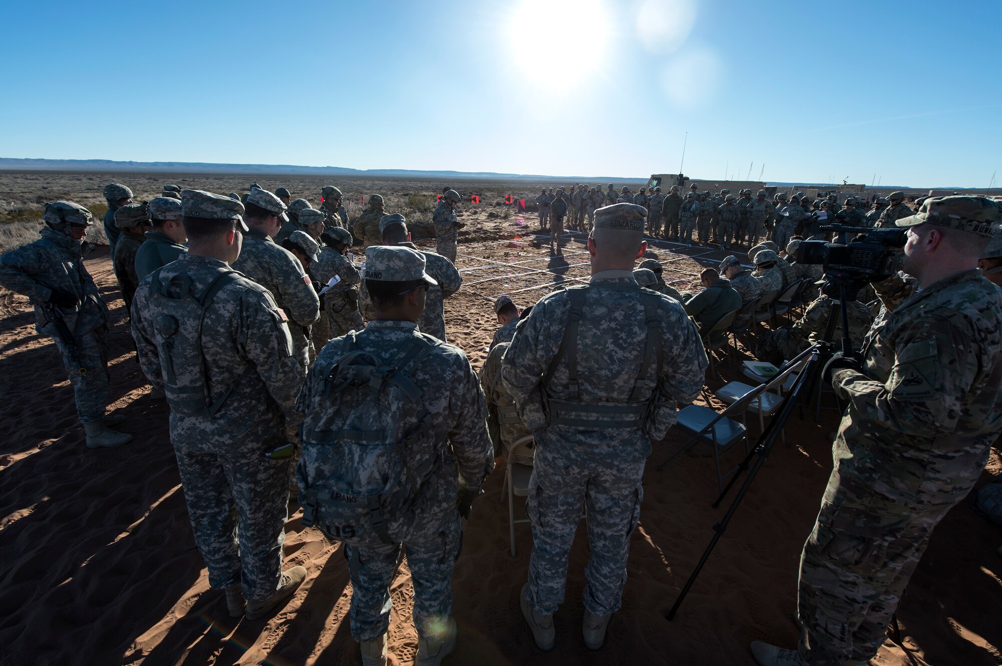 U.S. Army Soldiers and U.S. Air Force Airmen are briefed prior to beginning a rehearsal for exercise Iron Focus, Feb. 4, 2016, at the Oro Grande Training Complex at Fort Bliss, Texas. During the exercise, Airmen and Soldiers were evaluated through various Situation Training Exercises, which are short, scenario-driven, mission-oriented exercises designed to train participants by creating a realistic scenario of a deployed military operation. (U.S. Air Force photo by Senior Airman Olivia Dominique/Released)