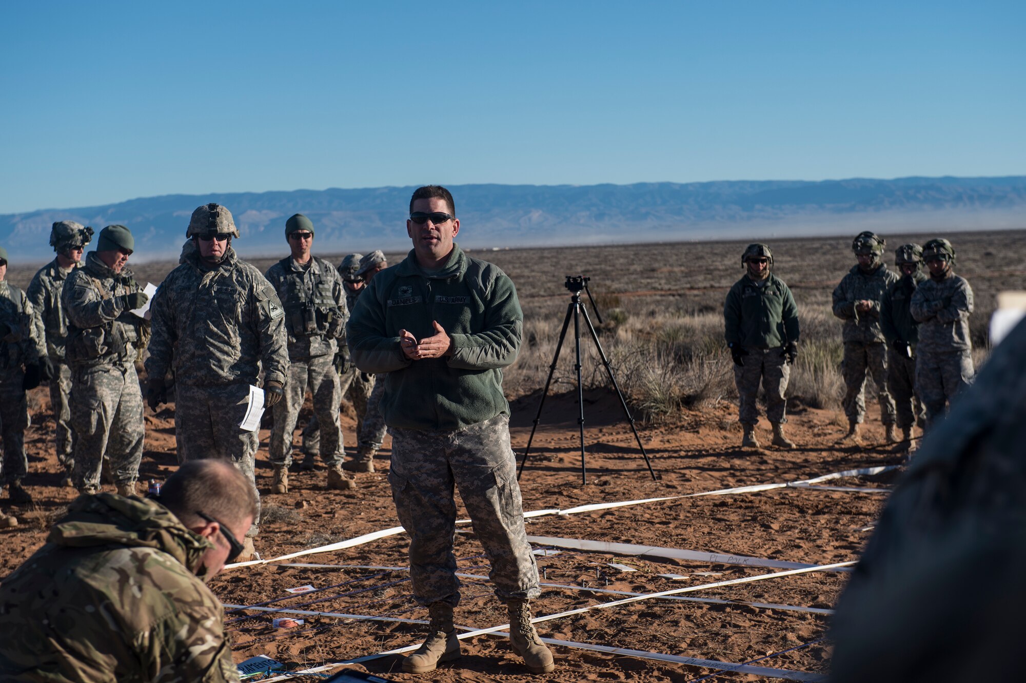 U.S. Army Col. Chip Daniels, 3rd Brigade Combat Team, 1st Armored Division commander, briefs Soldiers and U.S. Air Force Airmen prior to beginning a rehearsal for exercise Iron Focus, Feb. 4, 2016, at the Oro Grande Training Complex at Fort Bliss, Texas. The combined forces worked together to get a better understanding of each other’s capabilities and to prepare for future deployments. (U.S. Air Force photo by Senior Airman Olivia Dominique/Released)