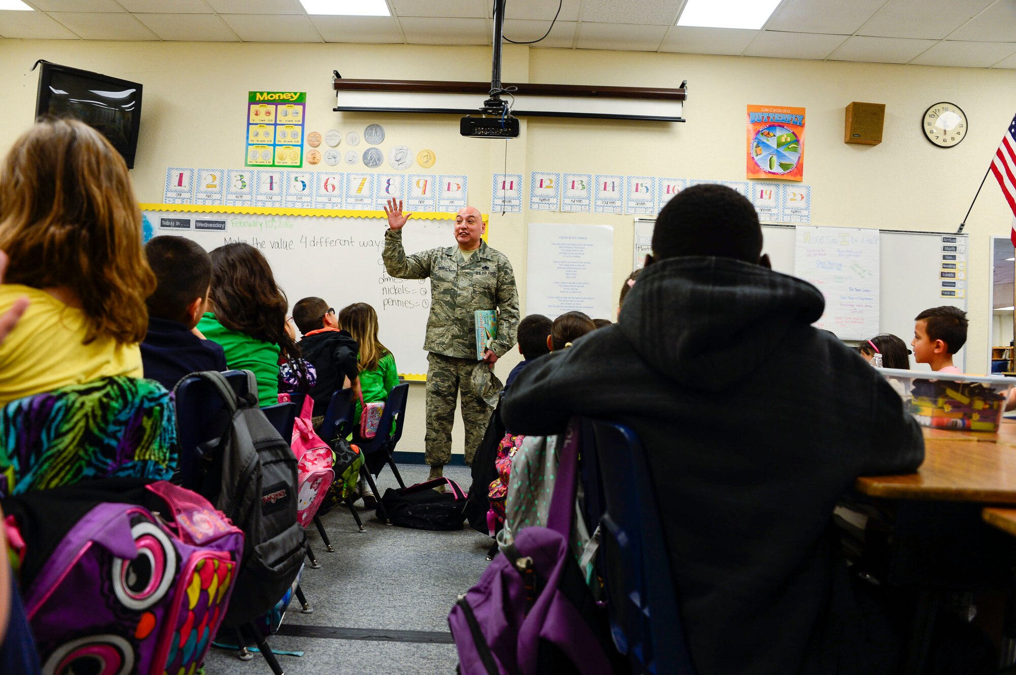 Chief Master Sgt. Jose Barraza, 12th Air Force (Air Forces Southern) Command Chief, visits a second grade class at Craycroft Elementary School, Tucson, Ariz., Feb. 10, 2016, during Love of Reading Week. During his visit, Barraza read to multiple classes and talked with the students about the importance of reading and education.  (U.S. Air Force photo by Tech. Sgt. Heather Redman/Released)