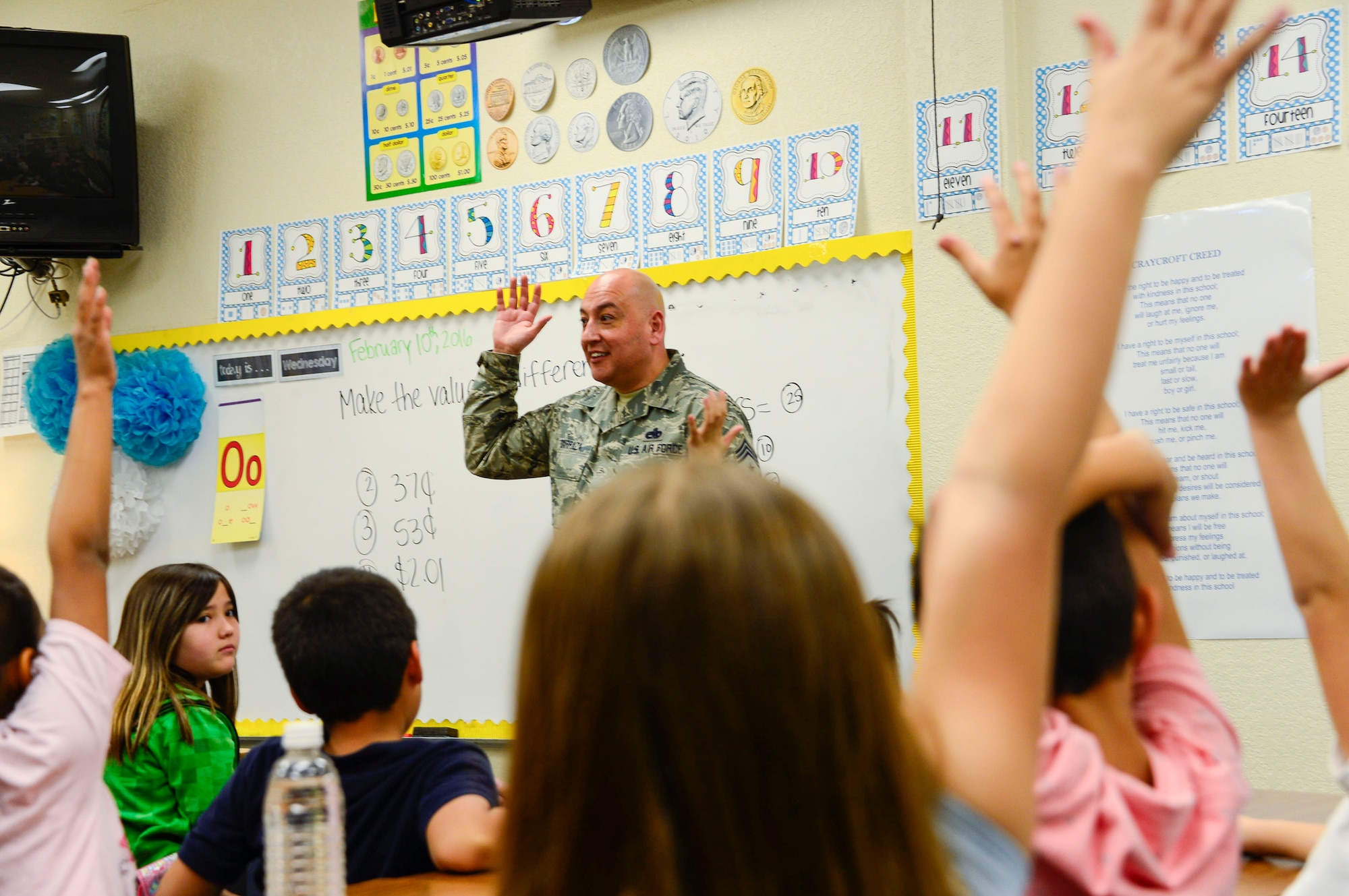 Chief Master Sgt. Jose Barraza, 12th Air Force (Air Forces Southern) Command Chief, visits a second grade class at Craycroft Elementary School, Tucson, Ariz., Feb. 10, 2016, during Love of Reading Week. During his visit, Barraza read to multiple classes and talked with the students about the importance of reading and education.  (U.S. Air Force photo by Tech. Sgt. Heather Redman/Released)