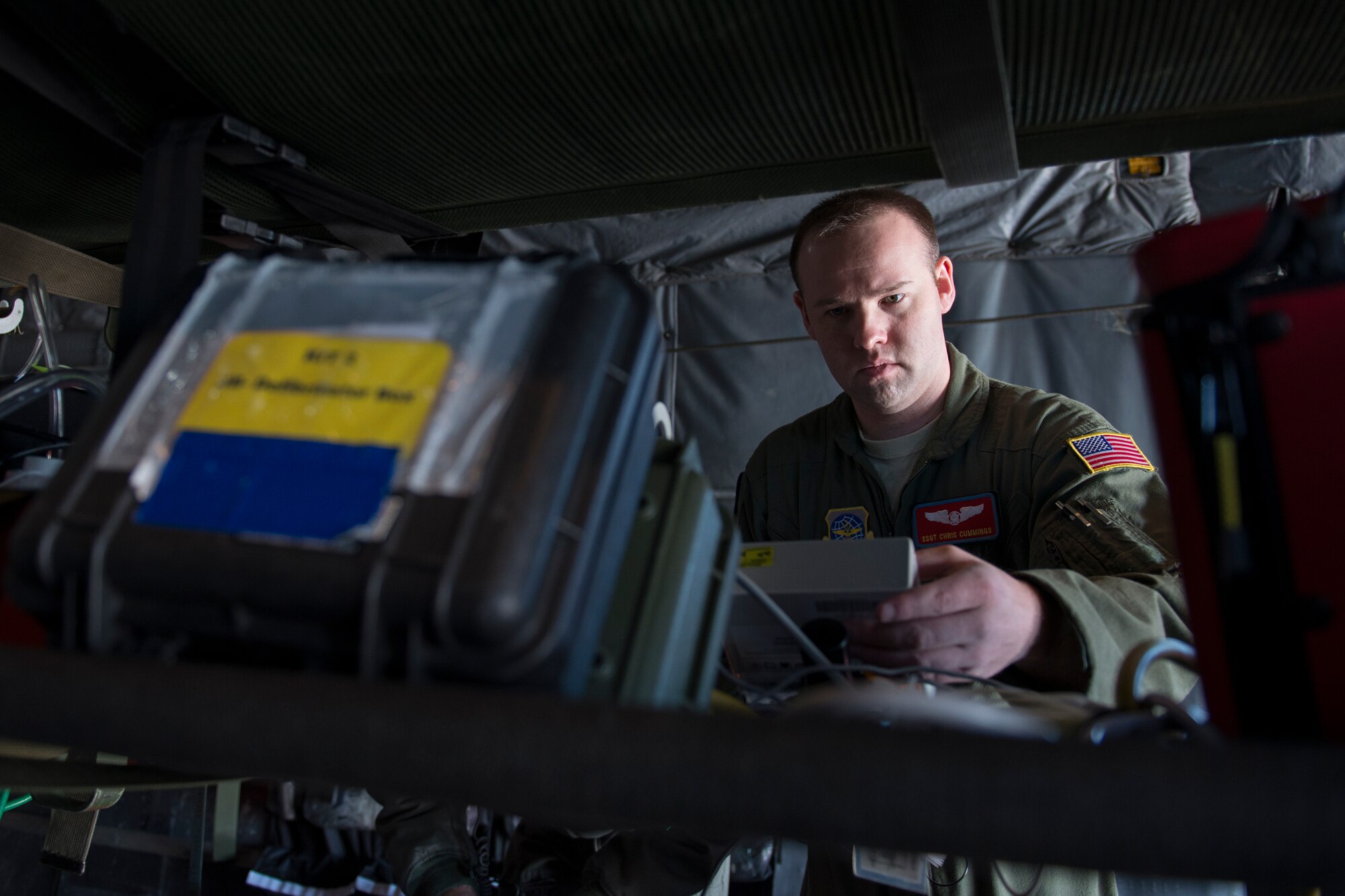Staff Sgt. Chris Cummings, 375th Aeromedical Evacuation Squadron technician, verifies that medical equipment is functioning properly during training in a simulated C-130 Hercules fuselage Jan. 28, 2016, Scott Air Force Base, Illinois. Trained technicians must set-up the interior of the aircraft and operate medical equipment, while doctors and nurses turn the planes into intensive care units. (U.S. Air Force photo by Airman 1st Class Melissa Estevez)