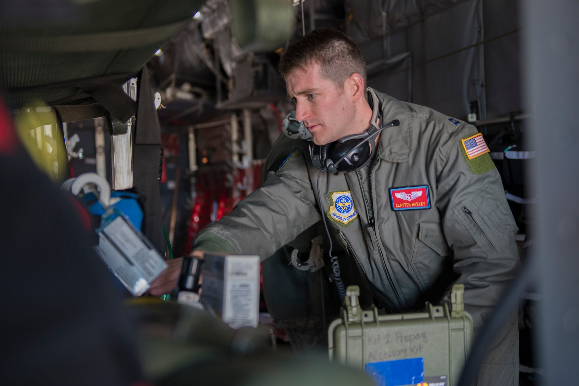 Capt. Clayton Harvey, 375th Aeromedical Evacuation Squadron flight nurse, verifies that all   medical equipment is functioning properly during training in a simulated C-130 Hercules fuselage Jan. 28, 2016, Scott Air Force Base, Illinois. The fuselage provides the 375th AES an opportunity to accomplish 50 percent of their required semi-annual training. (U.S. Air Force photo by Airman 1st Class Melissa Estevez)