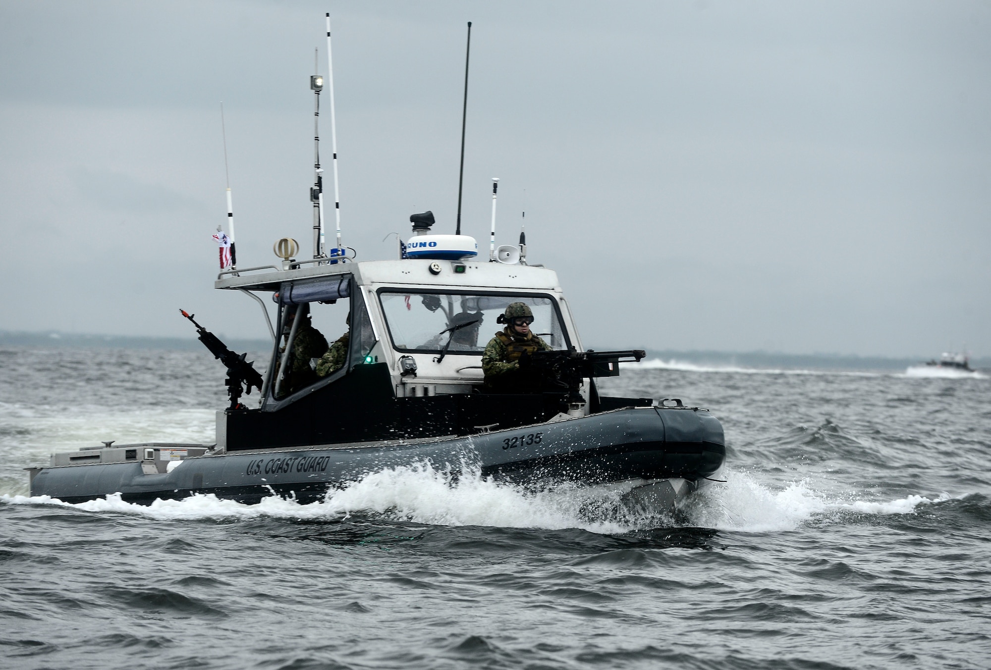 Members from U.S. Coast Guard Port Security Unit 307 perform high-speed tactical boat maneuvers during a field training exercise at MacDill Air Force Base, Fla., Feb. 6, 2016. The training focused on mobilization readiness, physical movement and personnel transport. (U.S. Air Force photo by Senior Airman Tori Schultz)