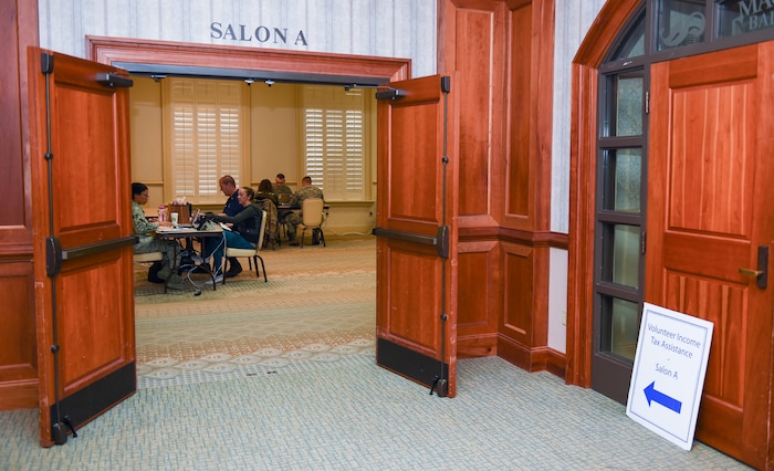 Members of Joint Base Charleston visit the Tax Center Feb. 9, 2016, at the Charleston Club on JB Charleston – Air Base, S.C. The Airmen working the tax center are able to provide tax return assistance to all active-duty, retirees and their dependents. (U.S. Air Force photo/Senior Airman Clayton Cupit)