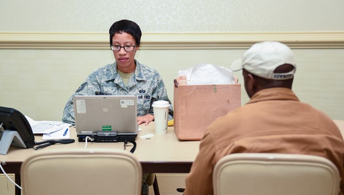 Tech. Sgt. Latoya Johnson-Mallory, 628th Legal Office paralegal, assists Joint Base Charleston members with their tax returns Feb. 9, 2016, at the Charleston Club on JB Charleston – Air Base, S.C. The Airmen working the tax center are able to provide tax return assistance to all active-duty, retirees and their dependents. (U.S. Air Force photo/Senior Airman Clayton Cupit)