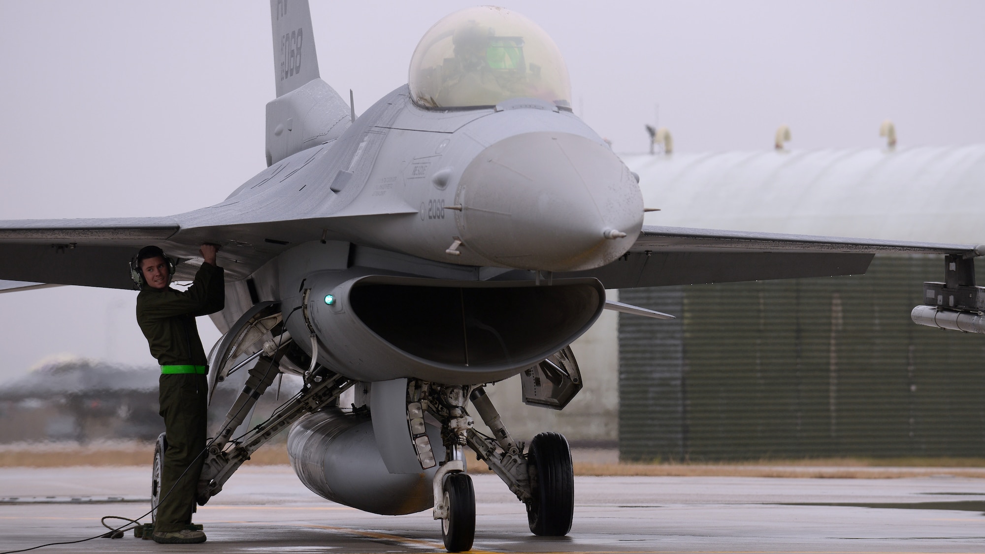 U.S. Air Force Staff Sgt. Kevin Madden, 31st Aircraft Maintenance Squadron dedicated crew chief, performs end-of-runway inspections on an F-16 Fighting Falcon before takeoff, Feb. 8, 2016, at Aviano Air Base, Italy. Team Aviano members must meet quarterly aircraft flying hours and adhere to the DUI Battle Plan to receive a wing goal day. (U.S. Air Force photo by Airman 1st Class Cary Smith/Released)