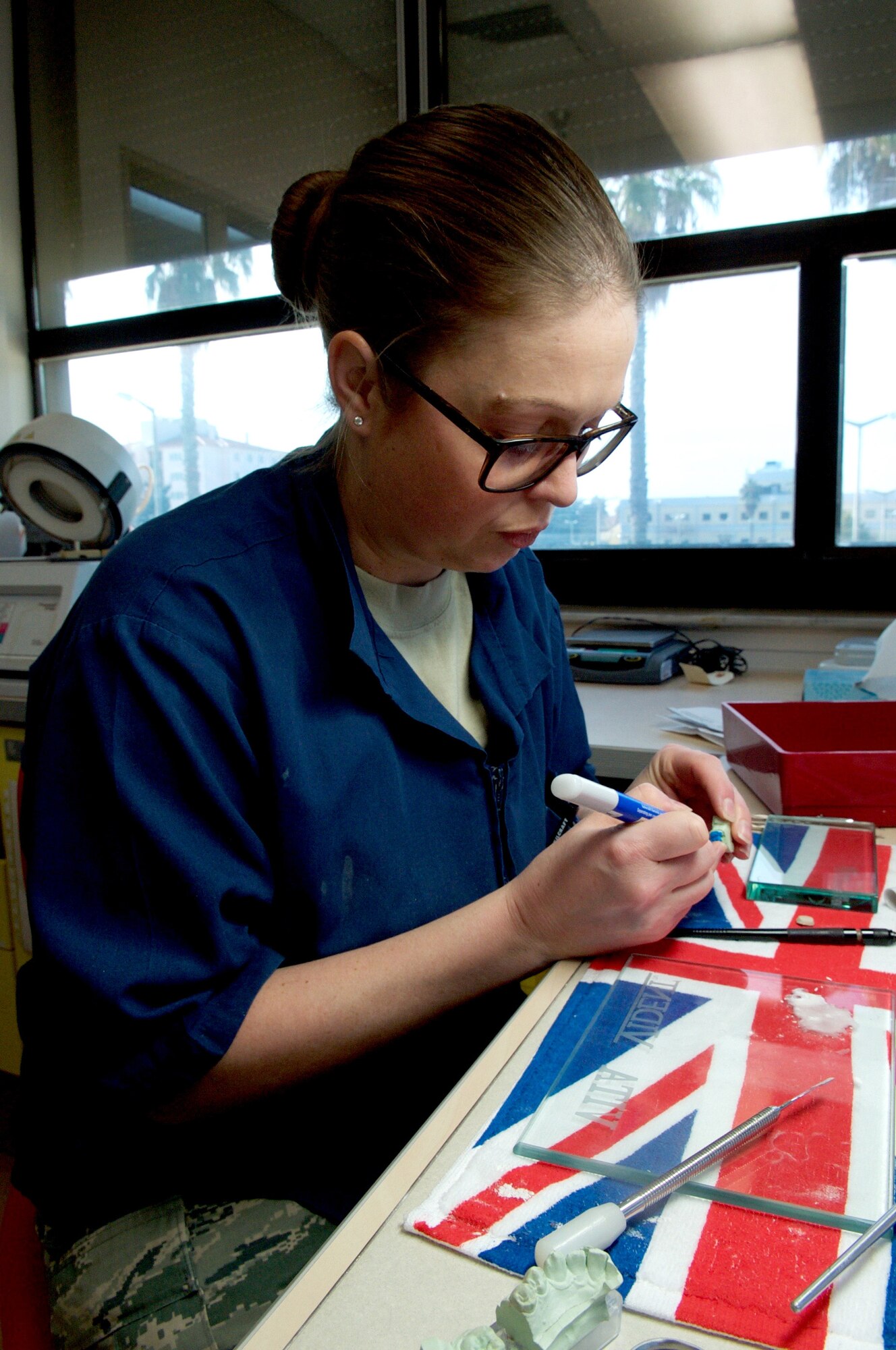 U.S. Air Force Tech. Sgt. Emily Jones, 39th Medical Operations Squadron dental flight chief, fabricates a porcelain crown Jan. 28, 2016 at Incirlik Air Base, Turkey. Fabrication is one way the dental flight here works to improve the overall oral health of Airmen and their families.(U.S. Air Force photo by Staff Sgt. Jack Sanders/Released)
