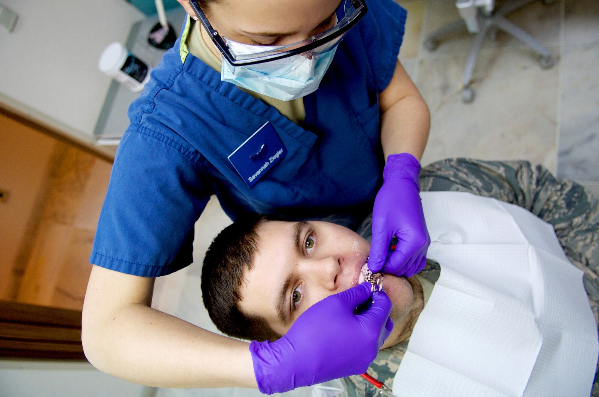 U.S. Air Force Airman 1st Class Savannah Ziegler, 39th Medical Operations Squadron dental technician, places takes an impression of Senior Airman Charles Poston, 39th Logistics Readiness Squadron fuels fixed facilities technician, teeth Jan. 28, 2016, at Incirlik Air Base, Turkey.  Impressions allow for molds to be created of patient’s teeth, which can be used to create mouth pieces, crowns, and false teeth. (U.S. Air Force photo by Staff Sgt. Jack Sanders/Released)