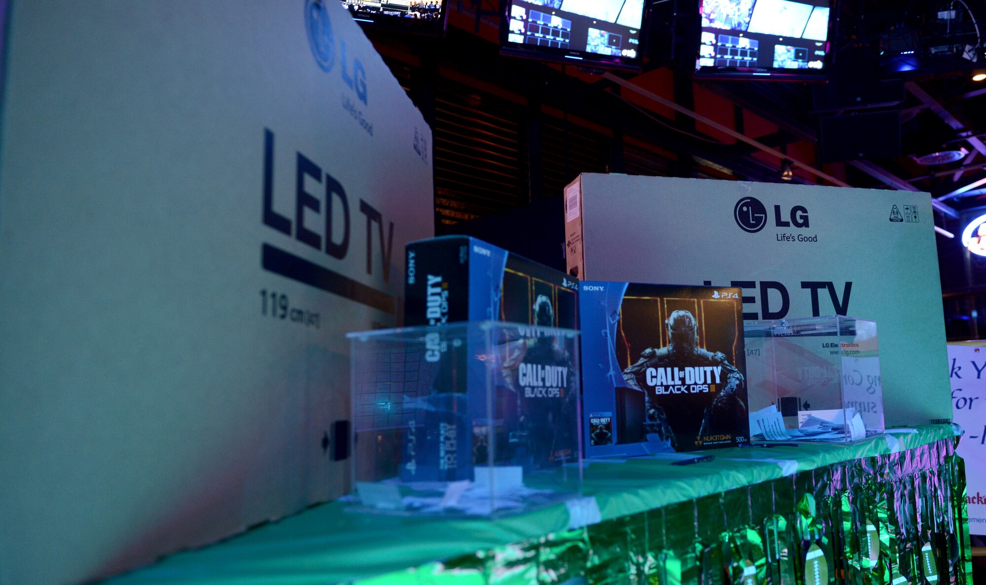 Prizes for the patrons of the Super Bowl L Madness party rest on a table Feb. 7, 2016, in the Ramstein Enlisted Club, at Ramstein Air Base, Germany. Prizes included National Football League lawn chairs and money. For Club members, furniture, additional cash, LED televisions and current-generation game consoles. (U.S. Air Force photo/Staff Sgt. Timothy Moore)