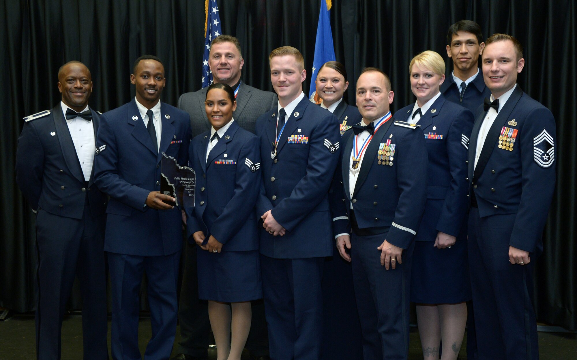 75th Medical Operations Squadron Public Health Flight personnel attend the 75th Air Base Wing Annual Awards Ceremony Feb. 6 at Hill Air Force Base, Utah. During the ceremony, the flight was named Team of the Year for 2015. (U.S. Air Force photo by: Alex R. Lloyd)