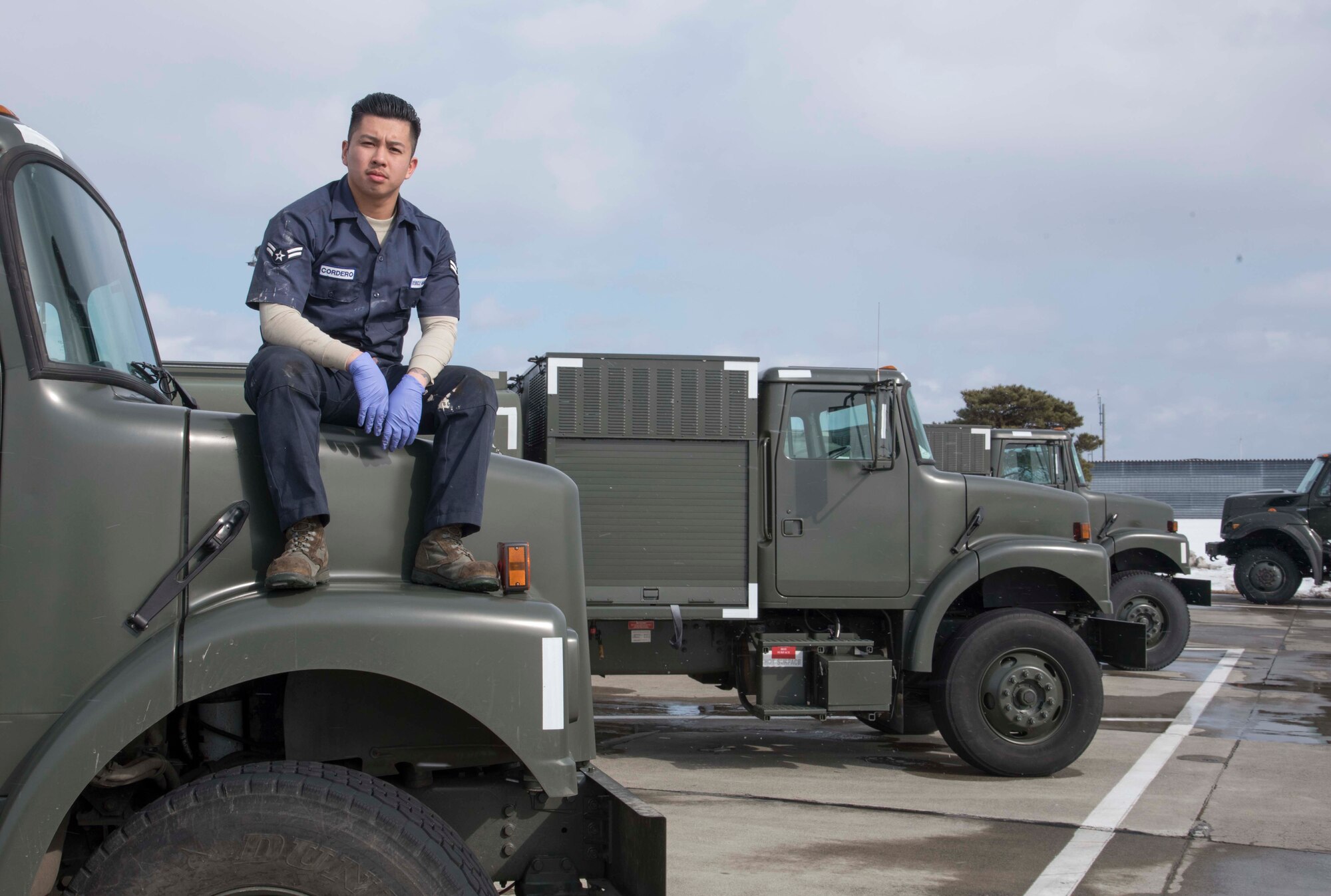 U.S. Air Force Airman 1st Class Derron M. Cordero, a vehicle and vehicular equipment maintenance journeyman with the 35th Logistics Readiness Squadron, poses for a Wild Weasel of the Week portrait at Misawa Air Base, Japan, Feb. 9, 2016. Cordero was recognized as the Wild Weasel of the Week by the 35th LRS for his superior performance, outstanding work ethic, and overall good conduct and discipline. Cordero hails from Stockton, California. (U.S. Air Force photo by Airman 1st Class Jordyn Fetter)