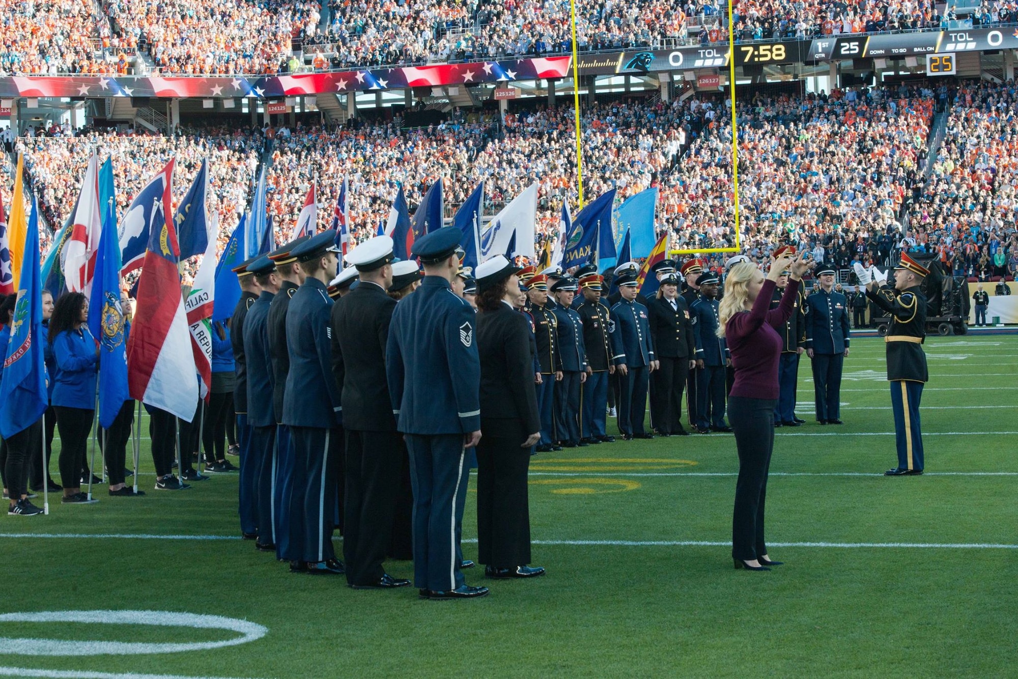 The Joint Armed Forces Color Guard and Joint Armed Service Choir perform during the opening ceremony of Super Bowl 50 at Levi's Stadium, Feb. 7, 2016, in Santa Clara, Calif. The opening ceremony included a performance by the choir followed by the presentation of the Colors and singing of the National Anthem by Lady Gaga. (U.S. Army Photo by Spc. Brandon C. Dyer) - at Levy's Stadium, Santa Clara California.
