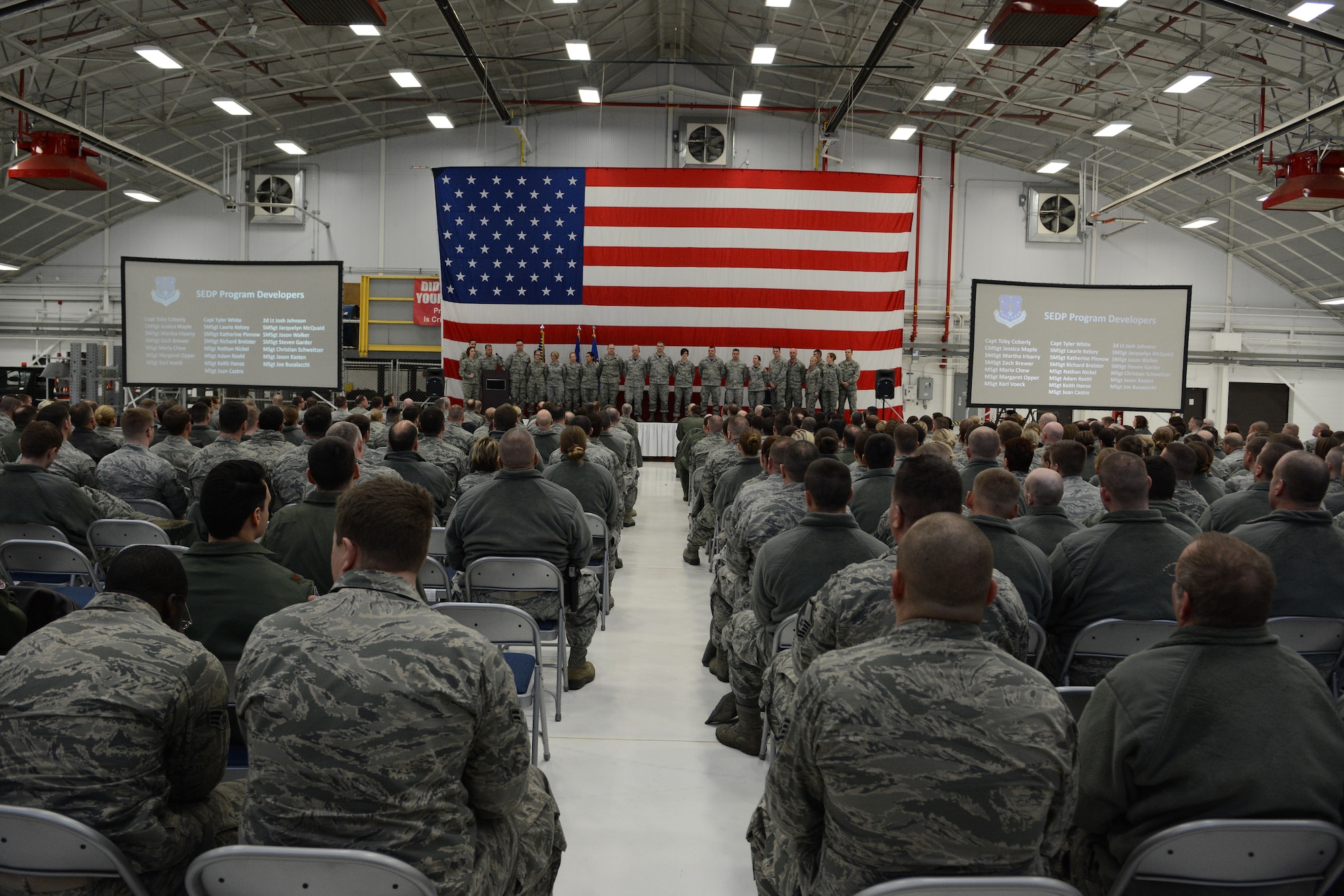 Senior Enlisted Development Program leaders stand on stage and are recognized for their 2015 achievements during the first annual awards ceremony in Hangar 406 on Feb. 7, 2016. The ceremony was used to recognize the achievements of several Airmen throughout base. (U.S. Air National Guard photo by Staff Sgt. Andrea F. Rhode)